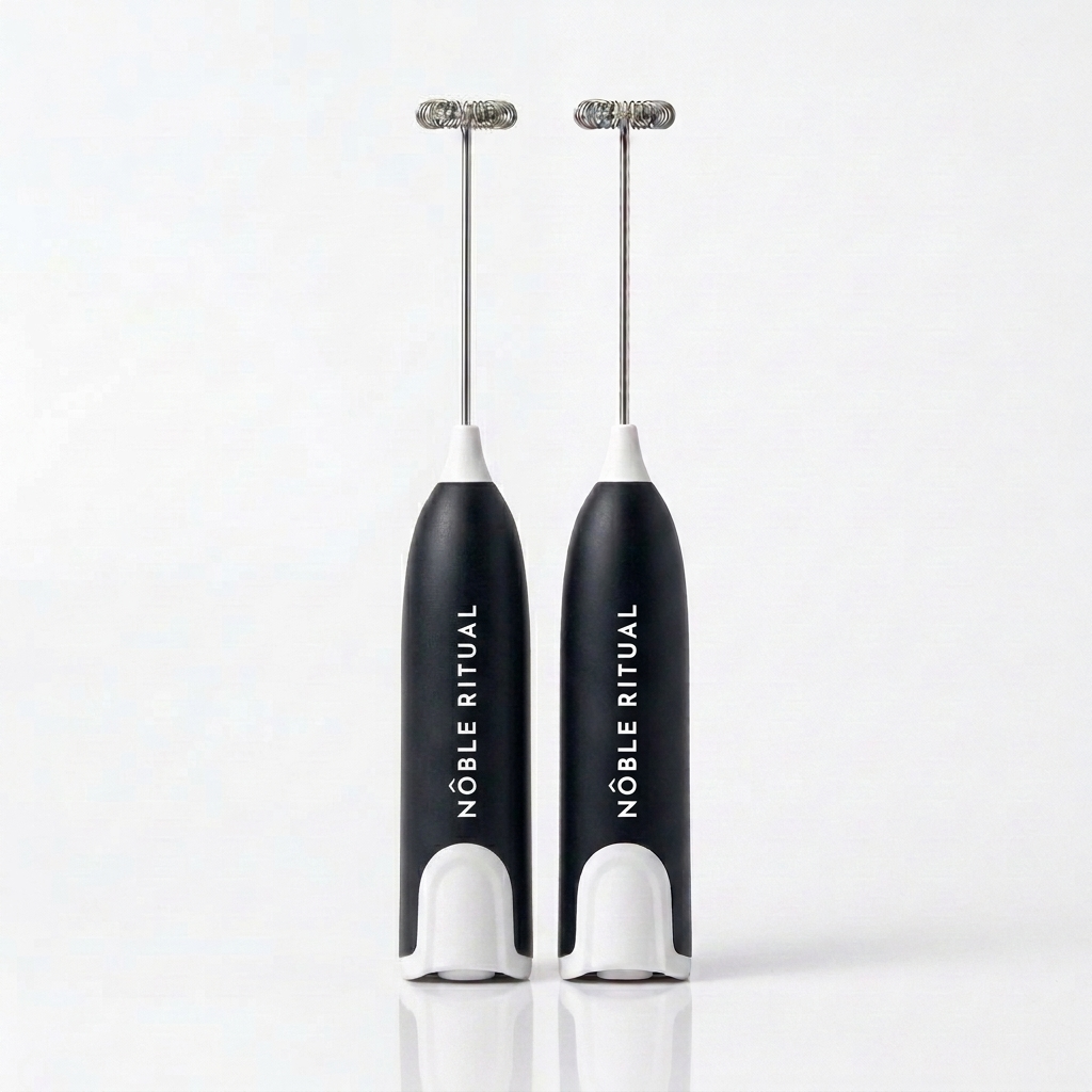Noble Frothé Set of 2 in Two Black: two black frothers with white collars and bases, vertical white NÔBLE RITUAL wordmarks and coiled steel whisks