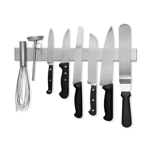 A brushed stainless magnetic strip holding kitchen knives on the wall