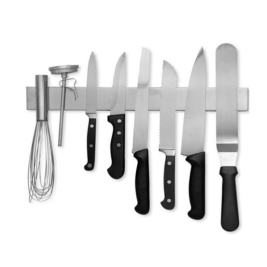 A brushed stainless magnetic strip holding kitchen knives on the wall