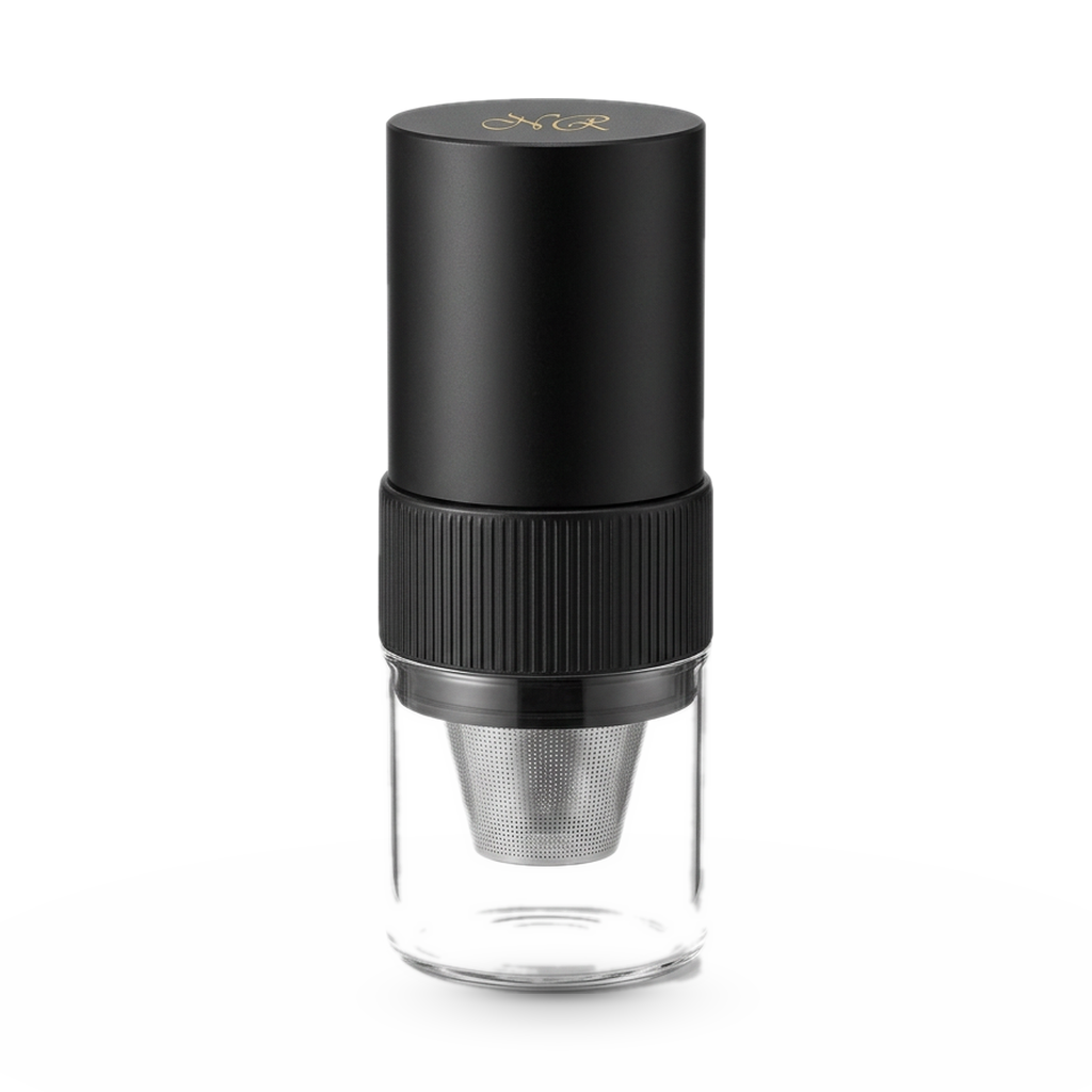 Noble Moulin portable electric coffee grinder with a glass catch cup, on a white background