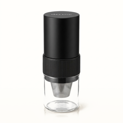 Noble Moulin portable electric coffee grinder with a glass catch cup