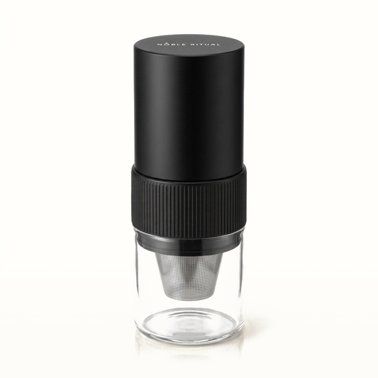 Noble Moulin portable electric coffee grinder with a glass catch cup