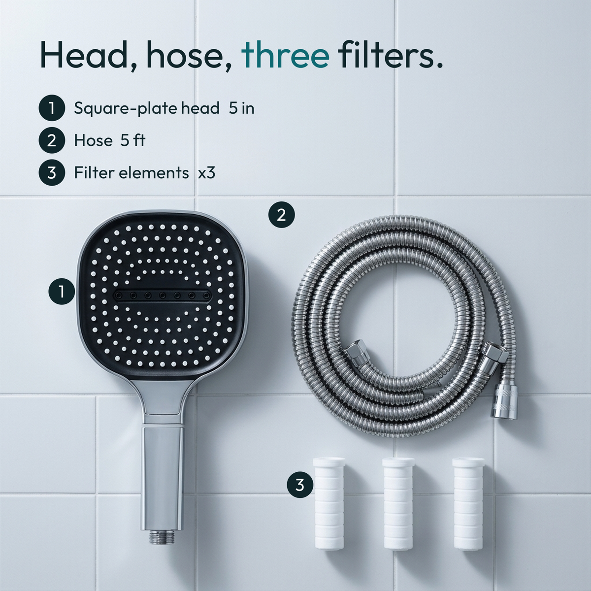 Head, hose and three filter elements laid flat on a tile surface