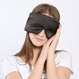 Black mulberry silk sleep mask, wide contoured shape, worn lying down