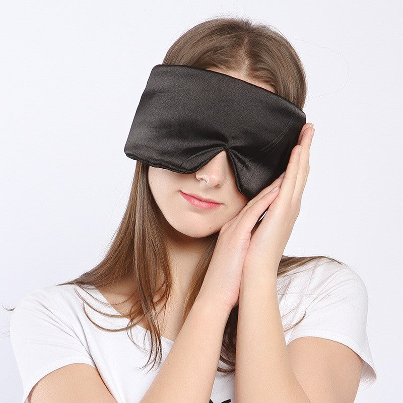 Black mulberry silk sleep mask, wide contoured shape, worn lying down