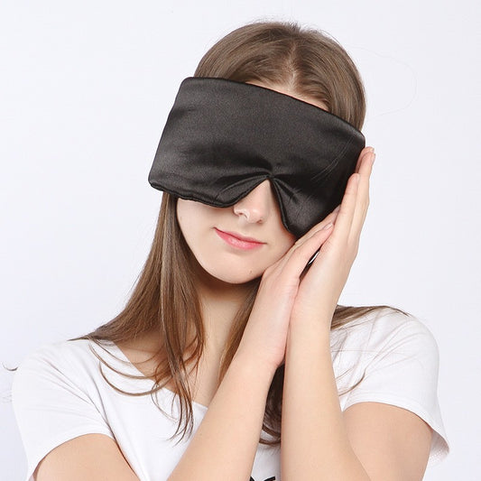 Black mulberry silk sleep mask, wide contoured shape, worn lying down